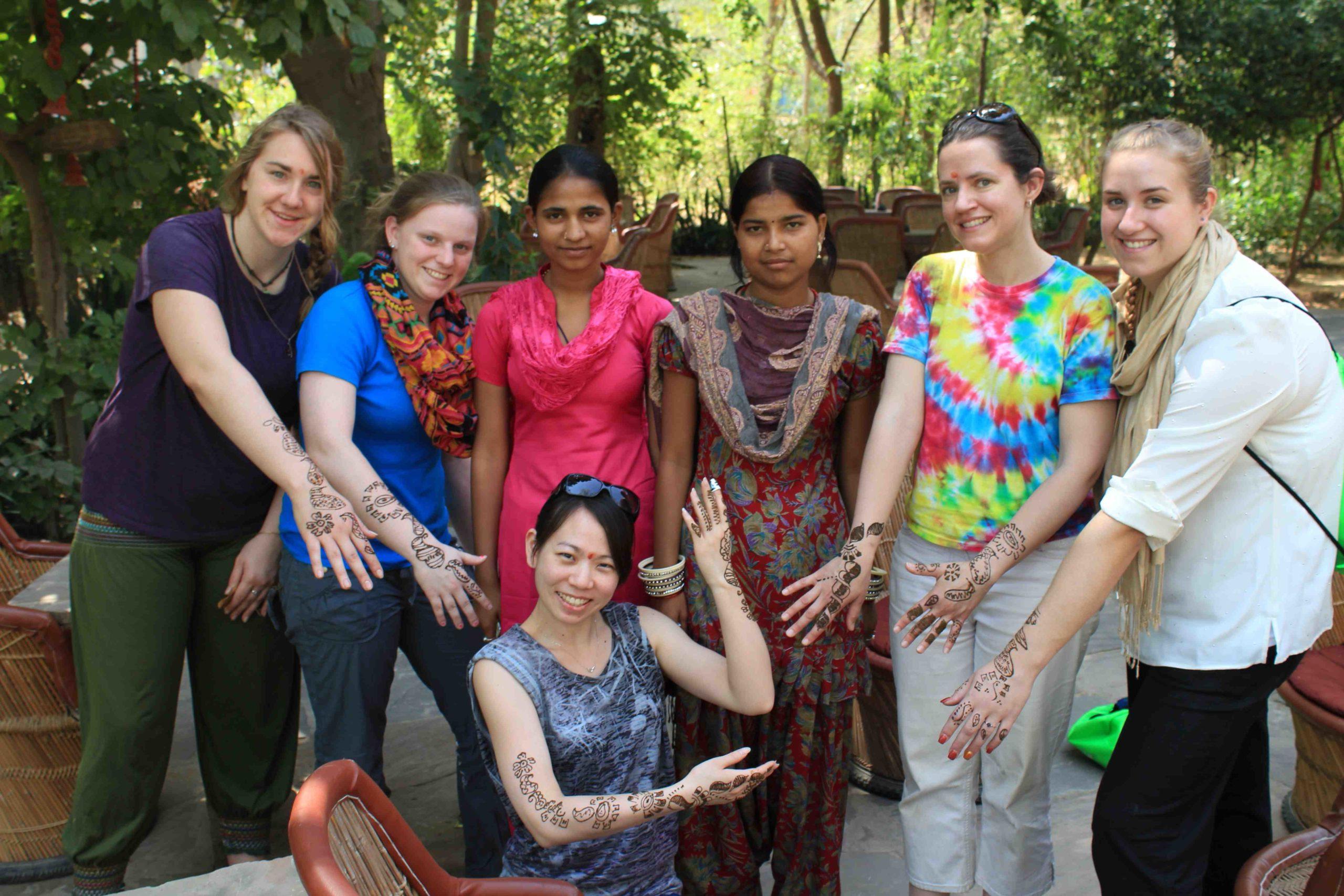 Students show off their henna tattoos during a Study Away trip to India